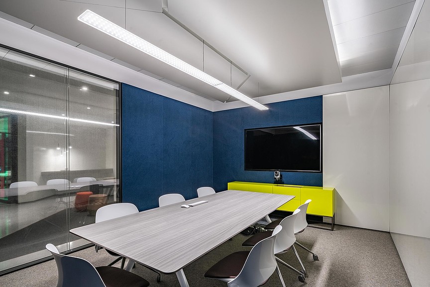 A room with a table and chairs.